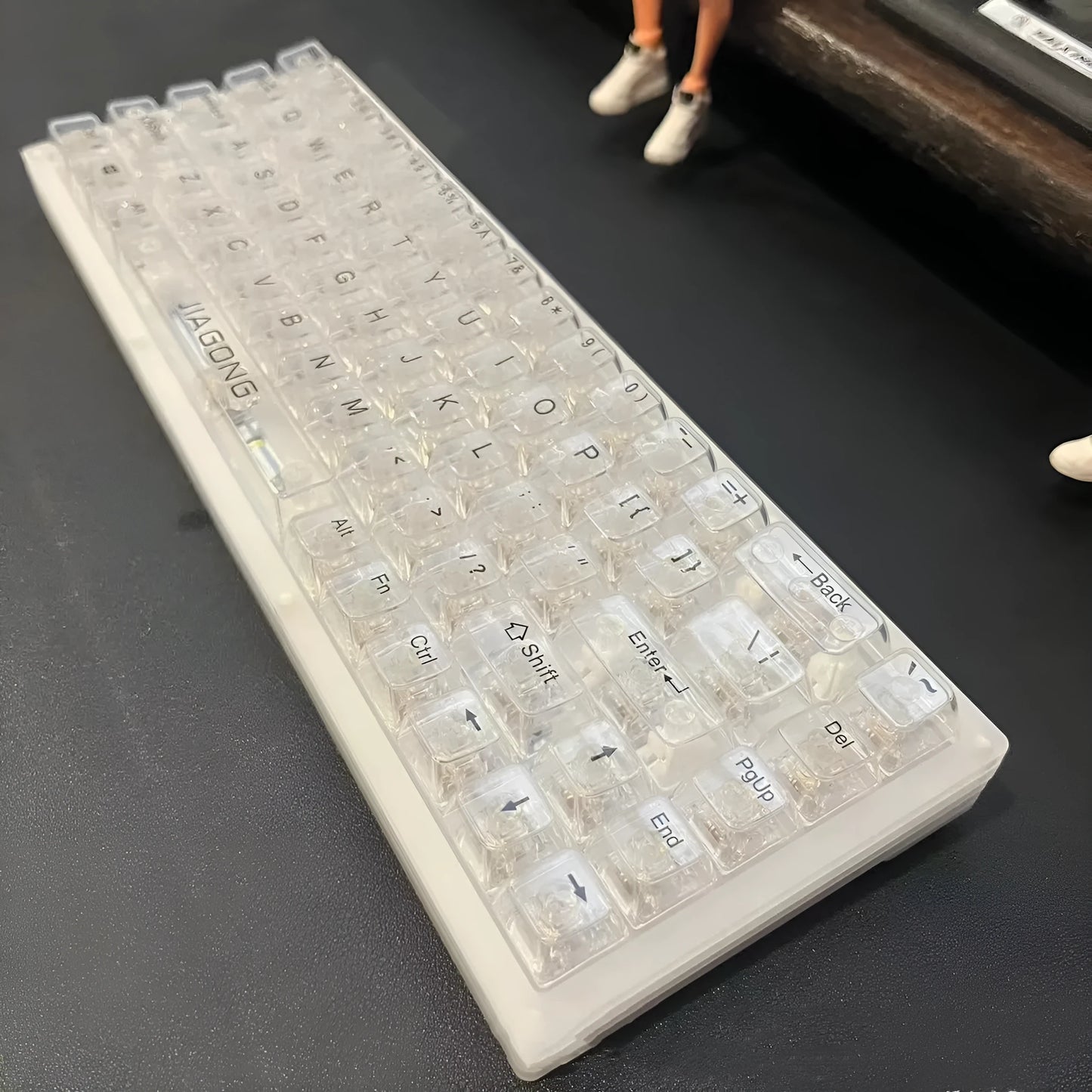 Full set of 132 transparent plastic keycaps for mechanical keyboard customisation on a white background.