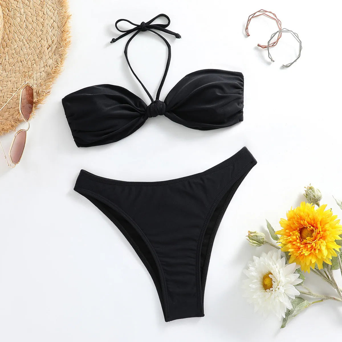 Black polyester women's bikini set with lace-up tube top and briefs, showing adjustable ties and streamlined design