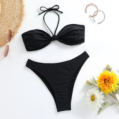 Black polyester women's bikini set with lace-up tube top and briefs, showing adjustable ties and streamlined design