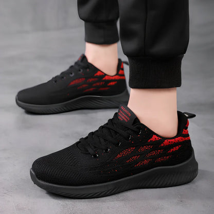 Men's black mesh sports shoes with red accent details and flexible PVC sole construction