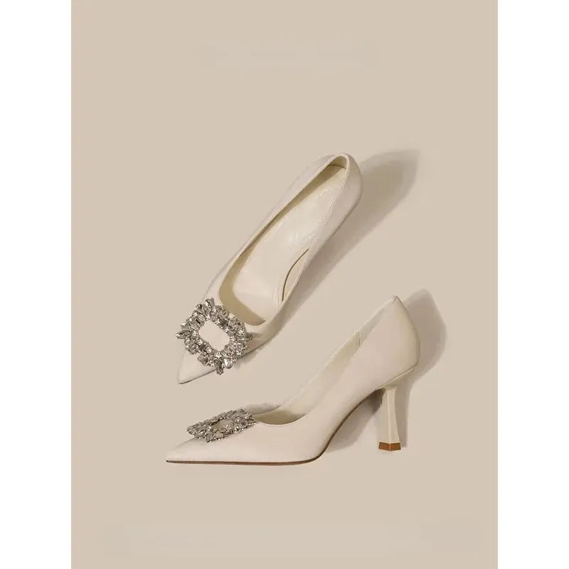 Women's pointed toe stiletto high heels in beige and black colours with low top design