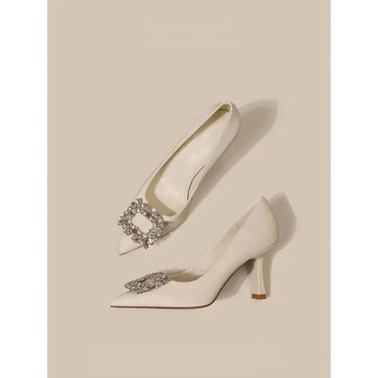 Women's pointed toe stiletto high heels in beige and black colours with low top design