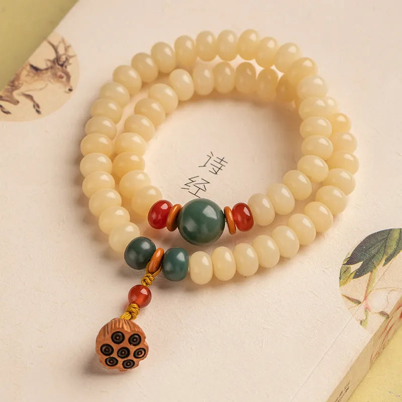 Cream-coloured wooden Bodhi root bracelet with flat round beads on 15-20cm wrist