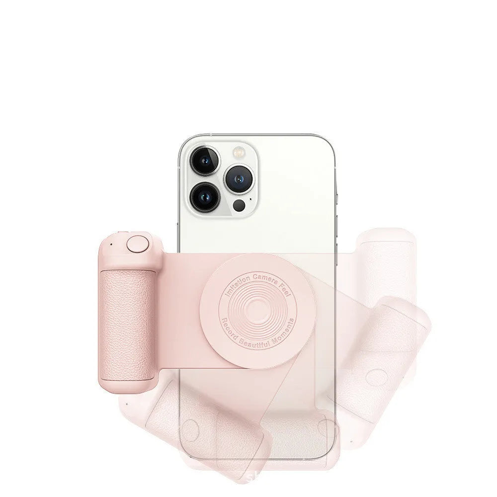 Black magnetic phone camera grip with rotatable bracket and ergonomic PU leather handle on a table.