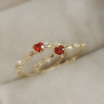 Gold and silver tone peach heart ring with zircon decoration, shown in sizes 6-10