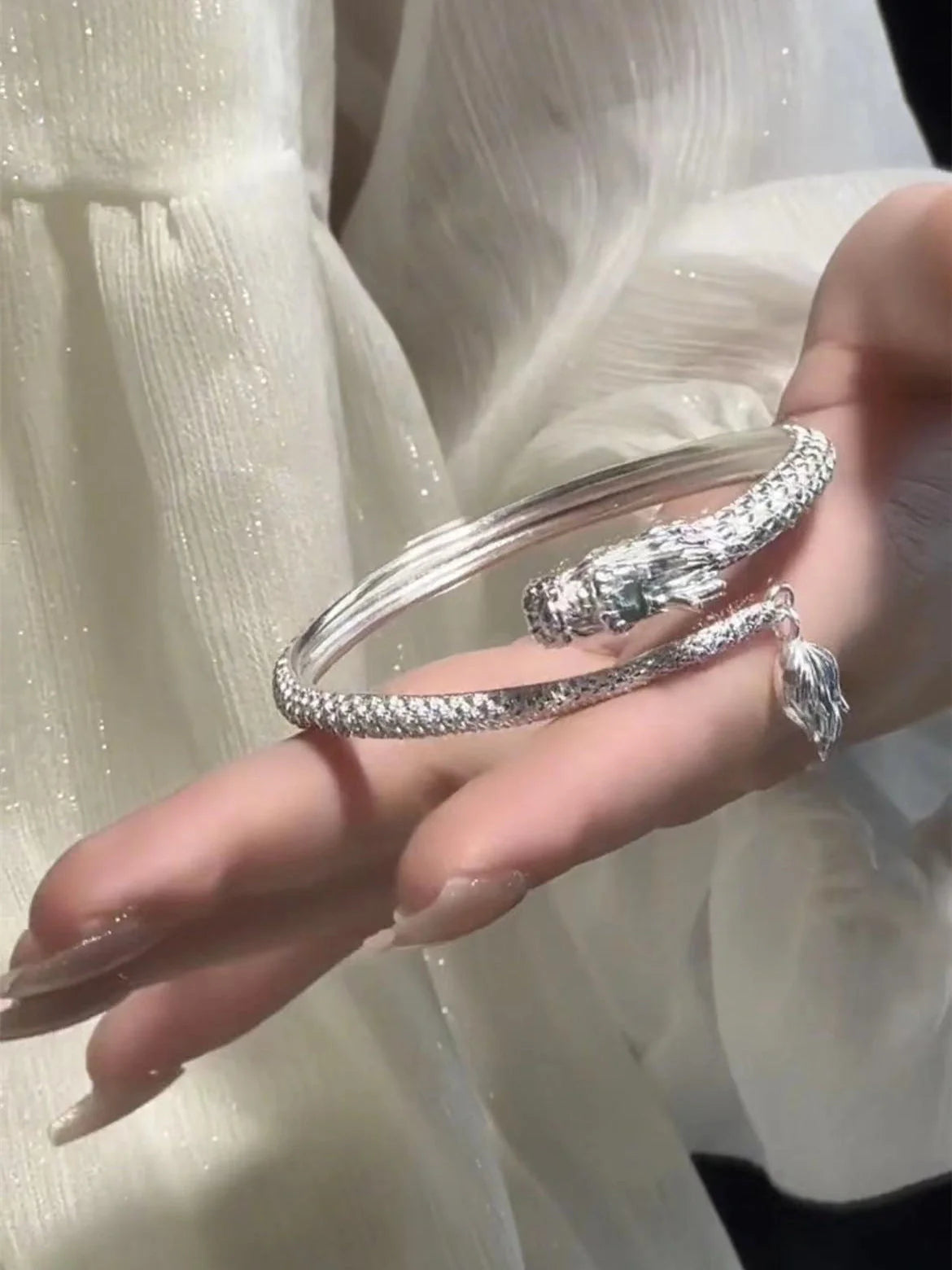 Adjustable Chinese dragon tail bangle with intricate relief design