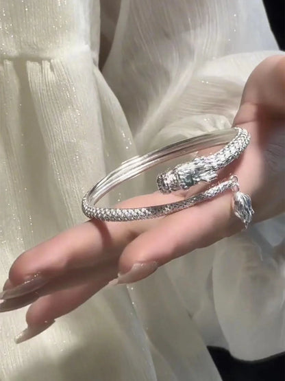 Adjustable Chinese dragon tail bangle with intricate relief design