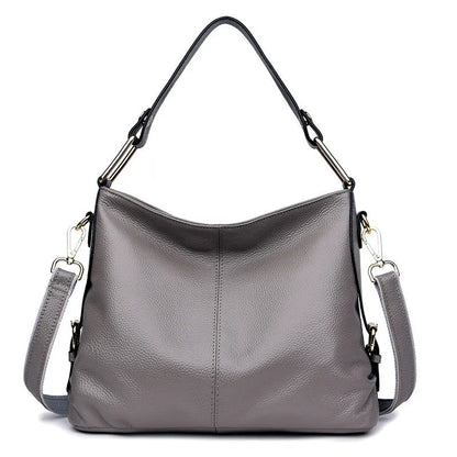 Black genuine leather vertical crossbody bag with multiple internal compartments and a sandwich pocket.