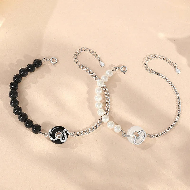 A New Chinese style 925 sterling silver couple's bracelet with snake zodiac detailing and a safe buckle clasp.