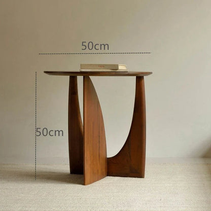 Round solid wood bedside table with geometric legs in walnut finish measuring 50cm diameter