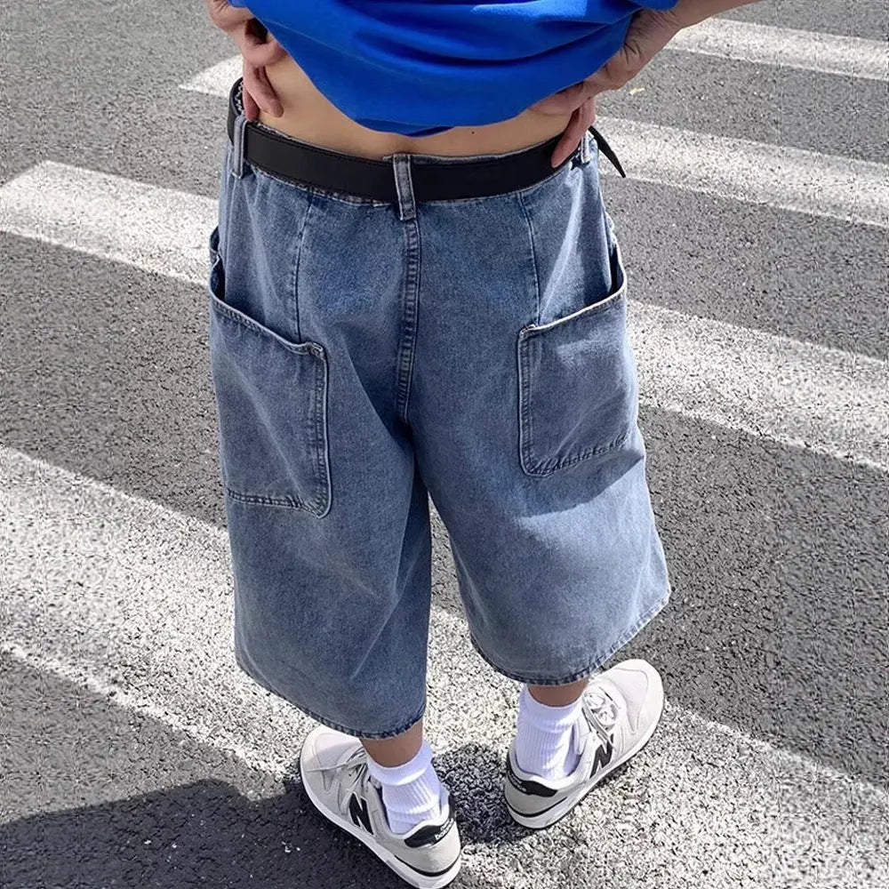 Men's blue washed denim shorts with high waist and cropped straight-leg design on a neutral background