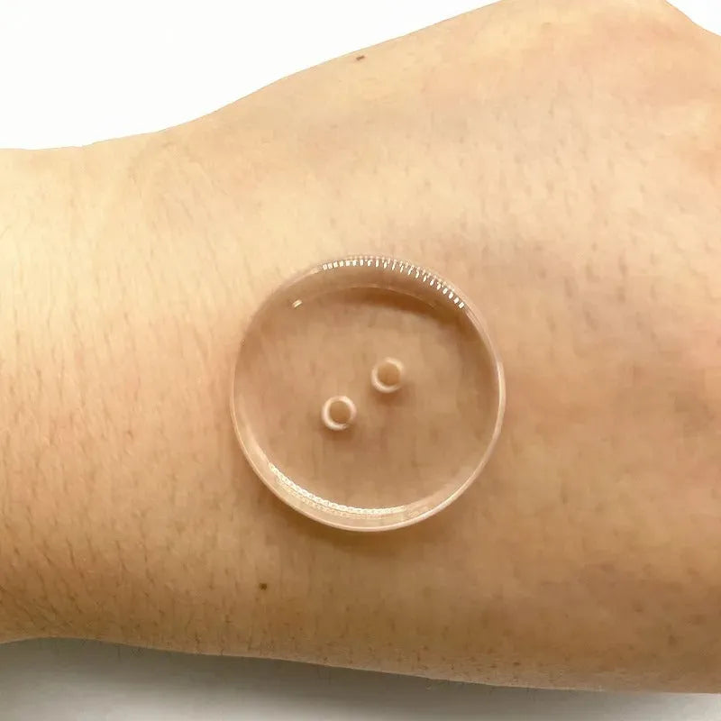 Transparent plastic resin sewing buttons with two holes, 10mm in diameter.