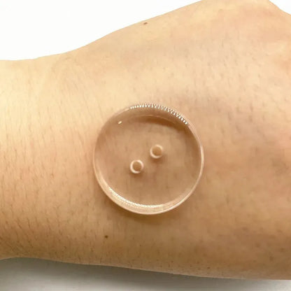 Transparent plastic resin sewing buttons with two holes, 10mm in diameter.