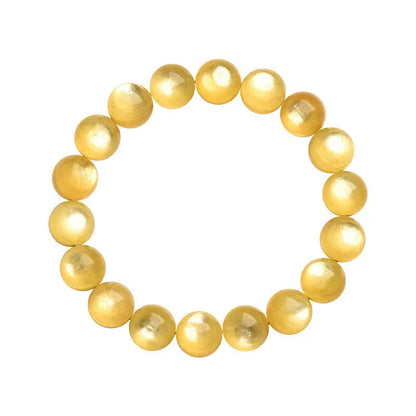 Yellow golden dragon mica round beads bracelet with polished geometric beads on a string.