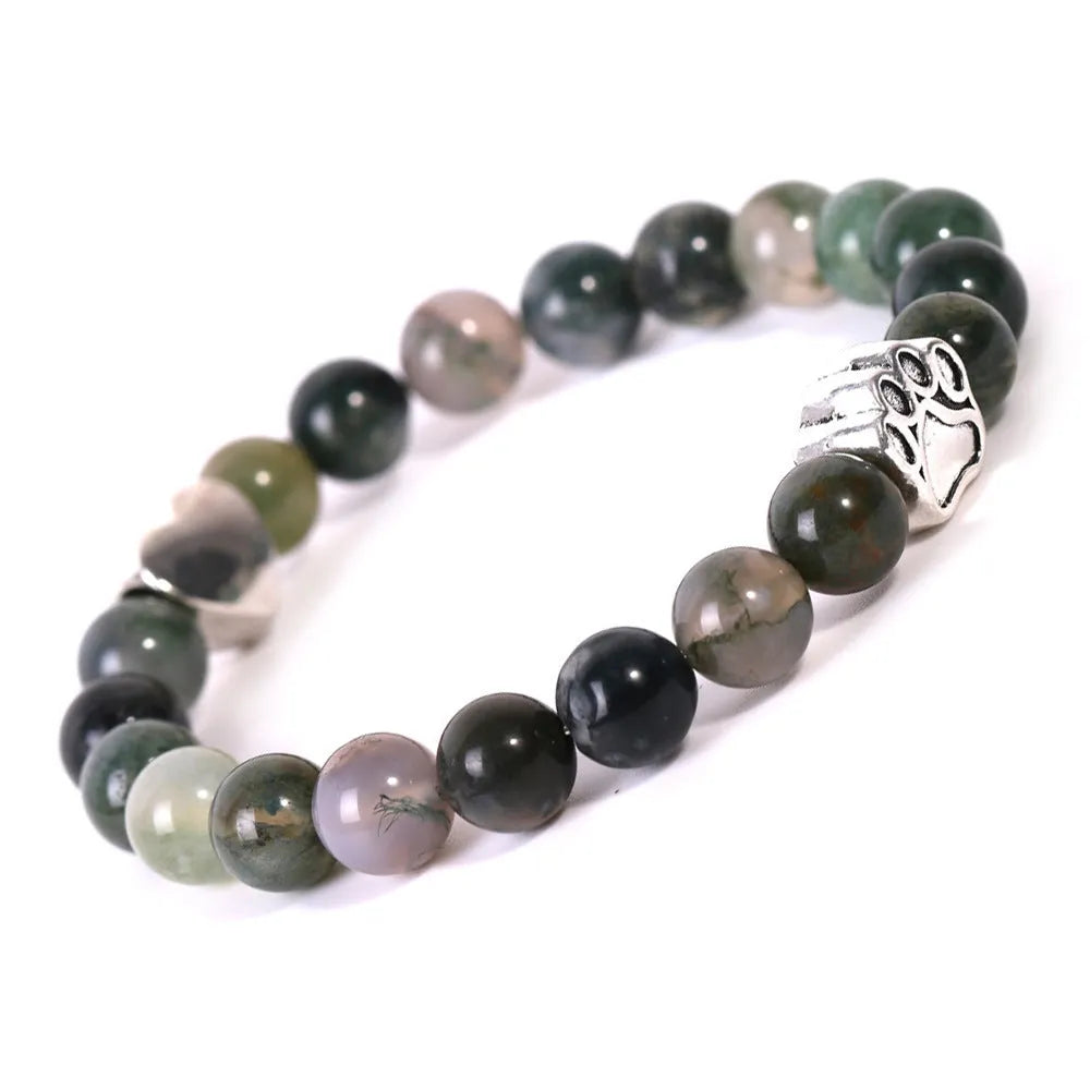 Tiger's eye stone bracelet with dog paw and Indian agate beaded designs on a wrist.