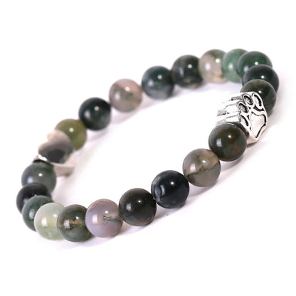 Tiger's eye stone bracelet with dog paw and Indian agate beaded designs on a wrist.