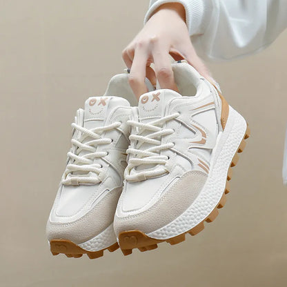Women's black sports casual shoes with round toe and front lace-up design on a flat heel.