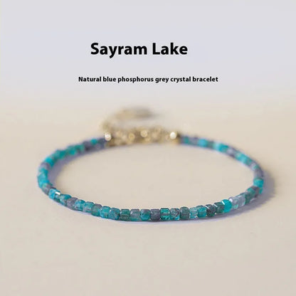 Women's blue apatite crystal bracelet with diamond-cut stones on wrist