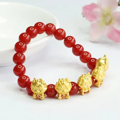 Red agate bracelet with carved five blessing dragon motifs on 8mm beads.
