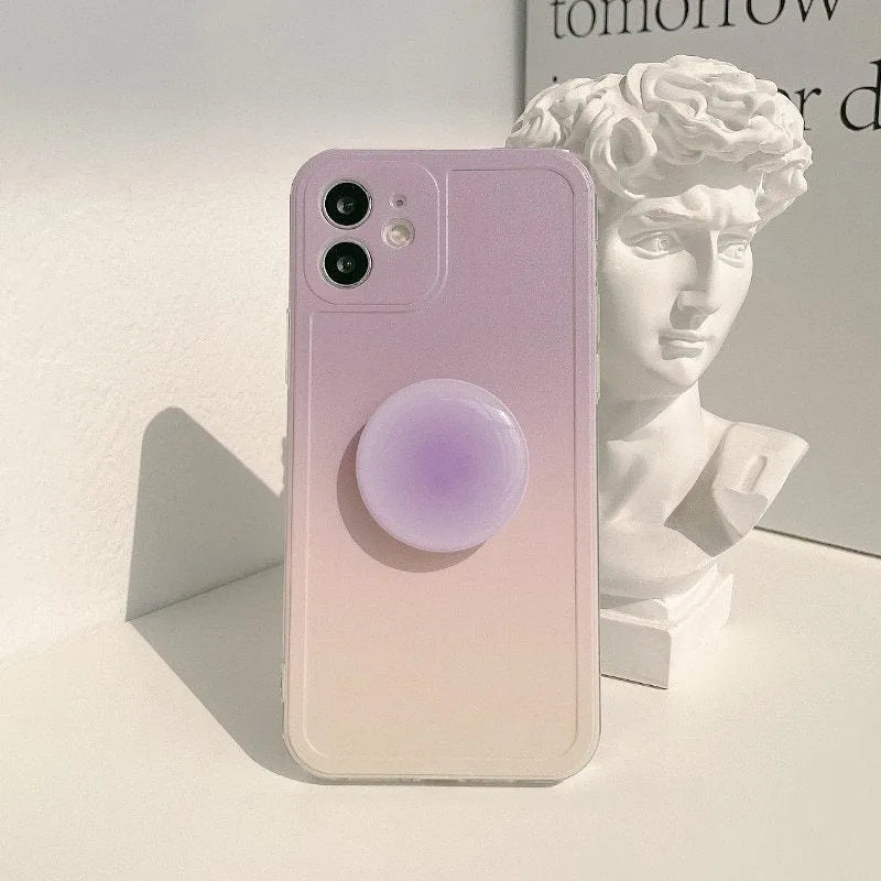 Yellow and purple gradient silicone iPhone case showing integrated airbag X bracket on the back.