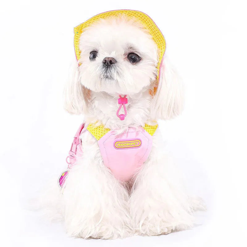 Pink polyester dog vest harness on a small white dog, showing back traction loop and casual fit.