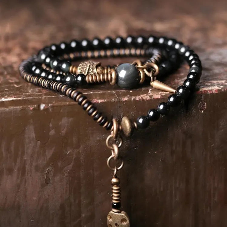 Women's versatile beaded bracelet in black featuring retro colourful multi-layered geometry design for unisex wear with natural styling