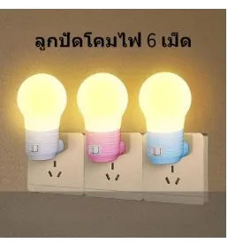 Plug-in bedside baby night light in white, blue, or pink shell with round shape.