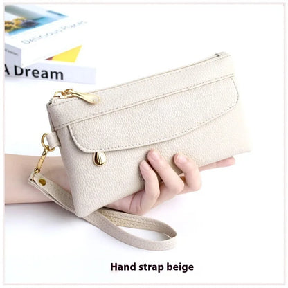 Soft surface square PU crossbody bag and clutch with internal zipper pocket in various colours.