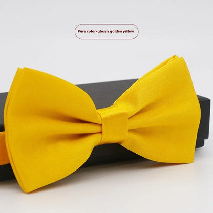 A solid colour pre-tied bow tie with an adjustable neck strap, shown in a classic flat head shape.