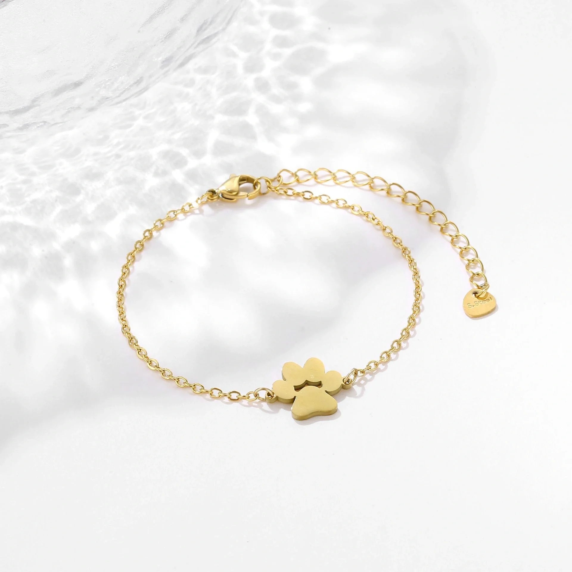 Stainless steel bracelet with a polished dog paw design, a stylish accessory for pet lovers