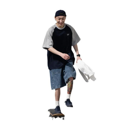 Men's blue loose-fit Japanese style long sleeve t-shirt with raglan sleeves on a hanger.