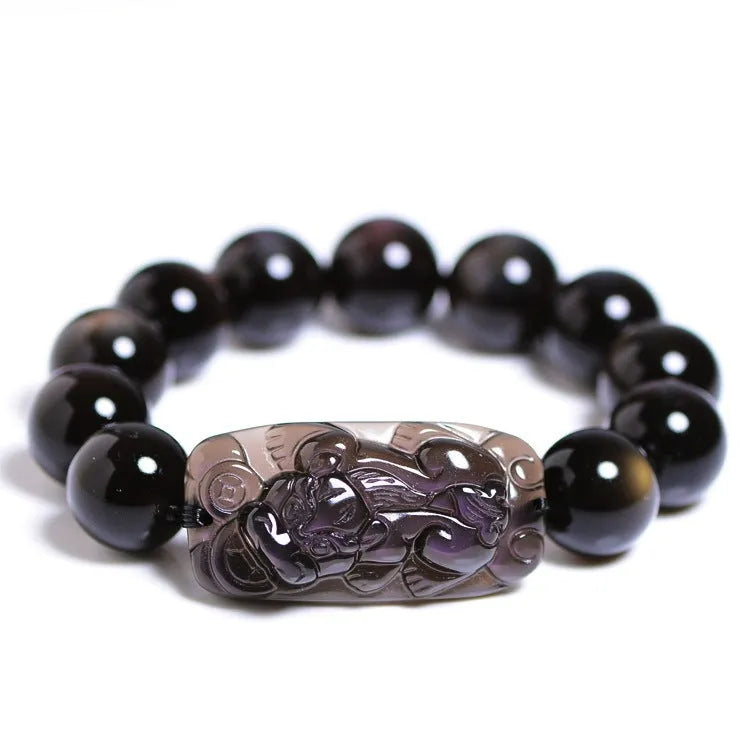 Natural crystal Pi Xiu bracelet with geometric beads on a wrist, showing ice stone colour.