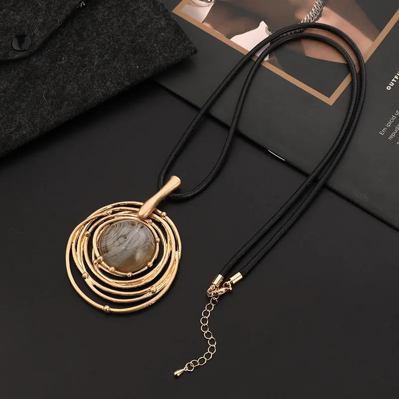 Gold geometric plaid pendant necklace on snakeskin wax rope chain with adjustable length