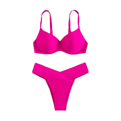 Women's solid colour split bikini swimsuit in fluorescent pink on a mannequin.