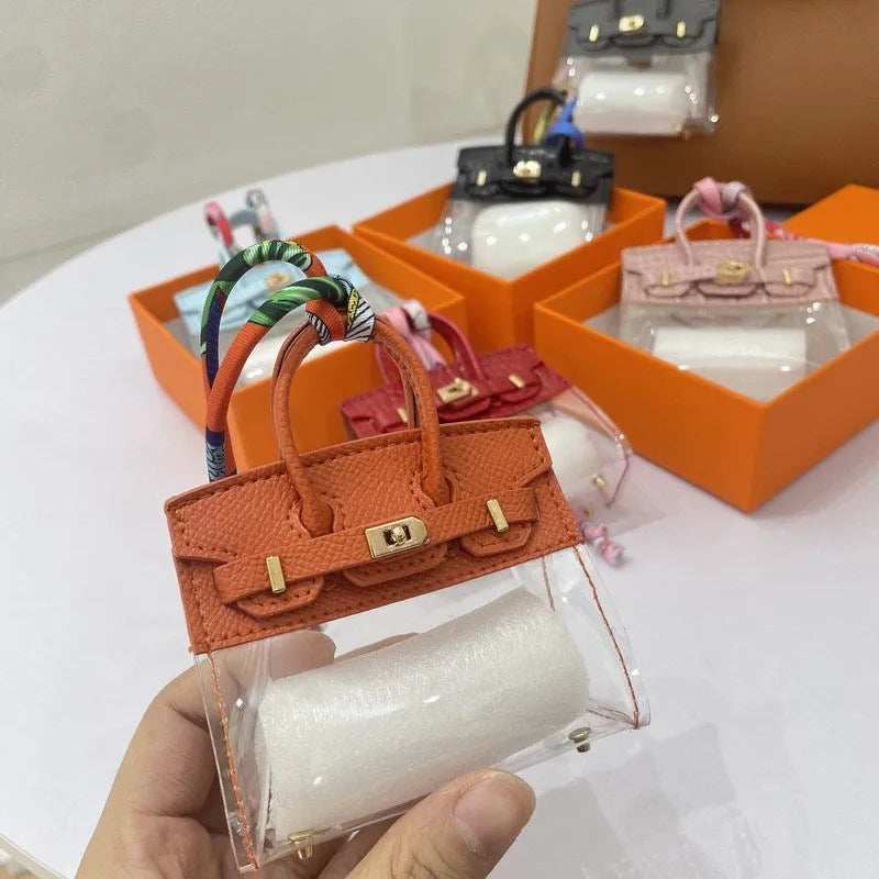 Artificial leather car key case in a crocodile pattern, shown alongside a palm print design option.