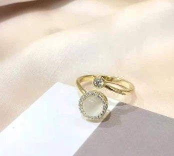 Adjustable spinner ring with rotating floral, geometric, and nature-inspired motifs for women's fashion and stress relief