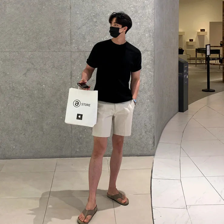 Men's loose straight casual shorts in black, khaki, and white solid colours.