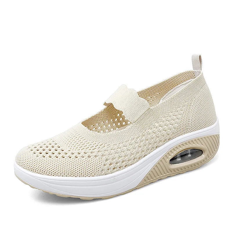 Women's black mesh slip-on casual shoes with round toe and low heel on white background
