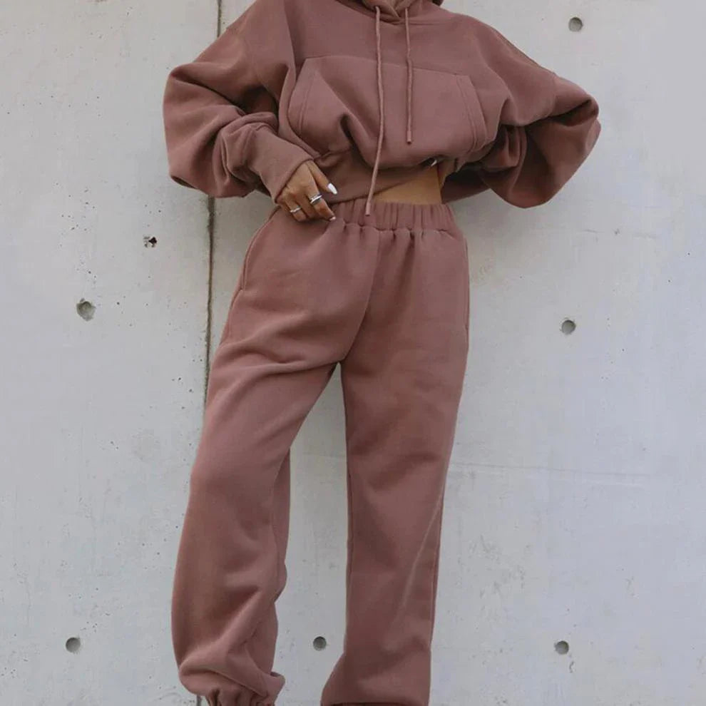 Women's polyester hoodie jacket and sports pants set in various colors for casual and athletic wear