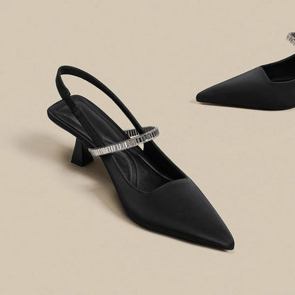 Black women's stiletto sandals with pointed toe and buckle strap closure