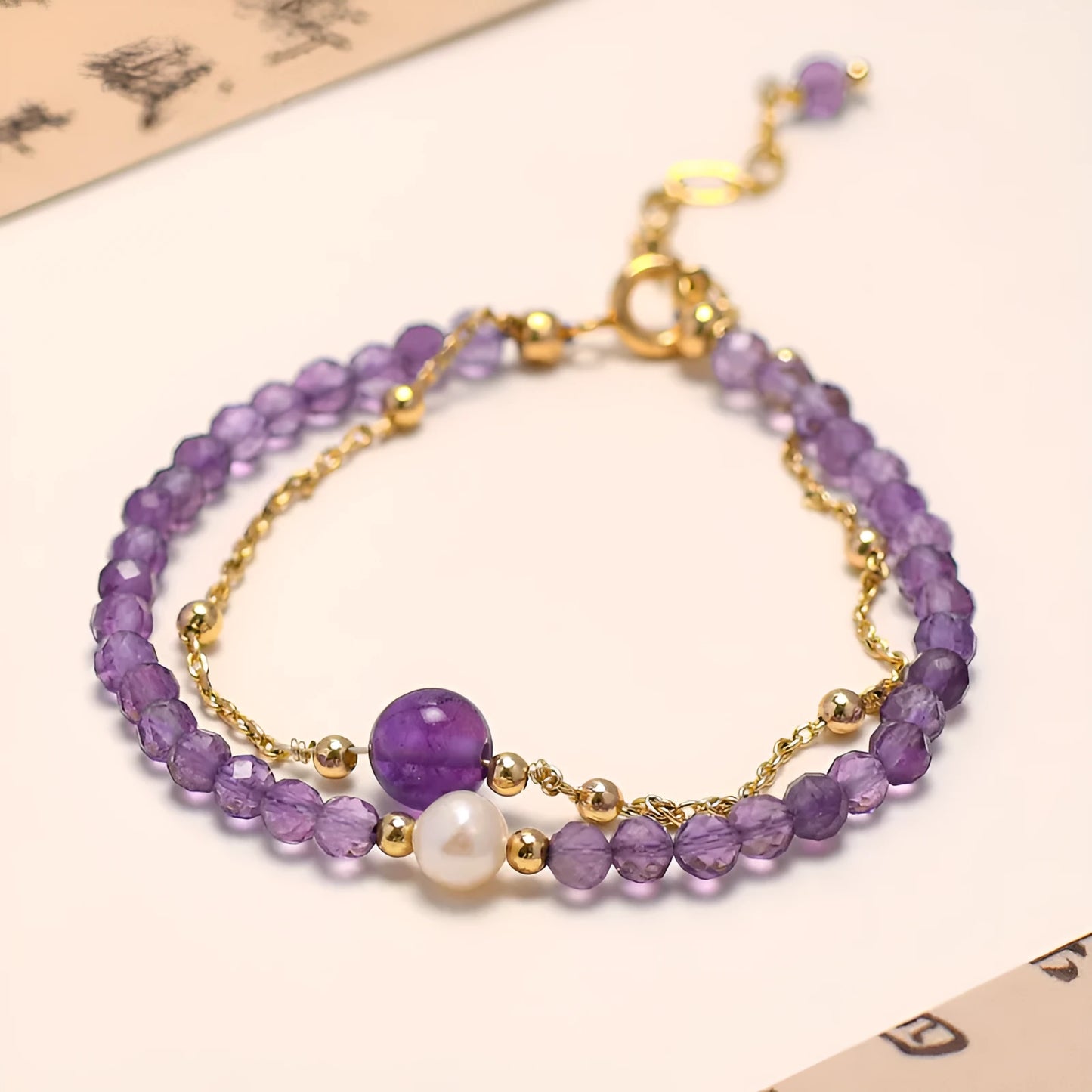Amethyst coloured Chinese-style crystal bracelet with a diamond-shaped design and electroplated finish.