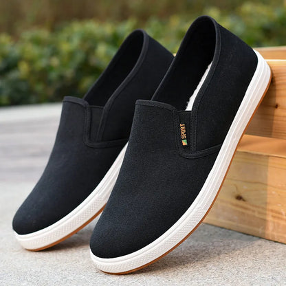 Men's low-top canvas cloth shoes with slip-on design and composite sole in black colour