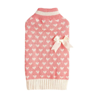 Dog wearing red love heart design sweater with bow decoration