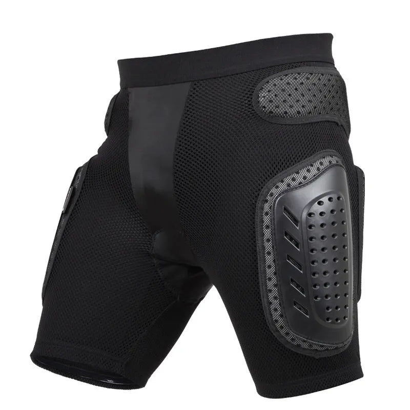 Black cycling hip protection pants shown laid flat, designed for impact safety during sports.