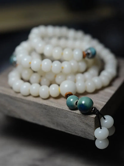 White jade bodhi root oblate bead bracelet with 108 beads in two sizes