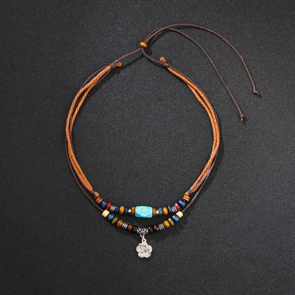 Men's wooden bead necklace with turquoise wax rope and alloy geometric flower pendant