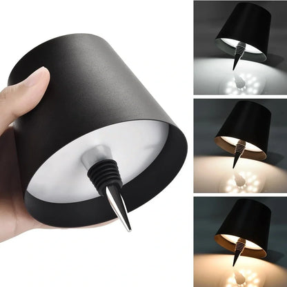 White and black LED wine bottle table lamps with USB charging and dimmable lighting on wooden surface