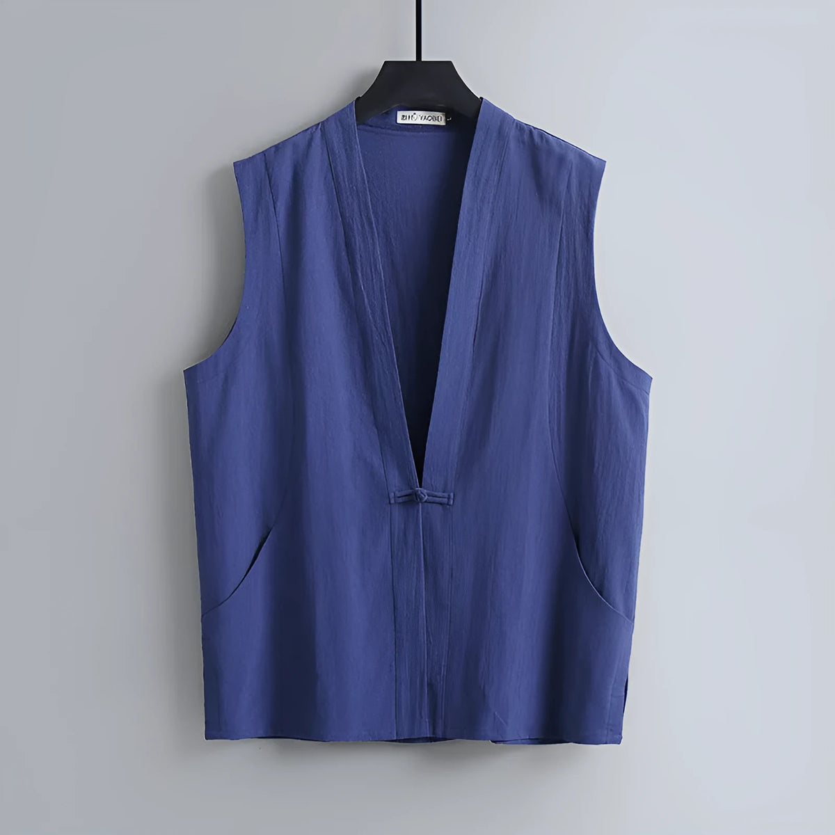 Men's light grey linen sleeveless vest with loose fit on hanger