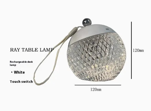 Small portable desk lamp with touch dimmer in gold finish, 12cm tall.