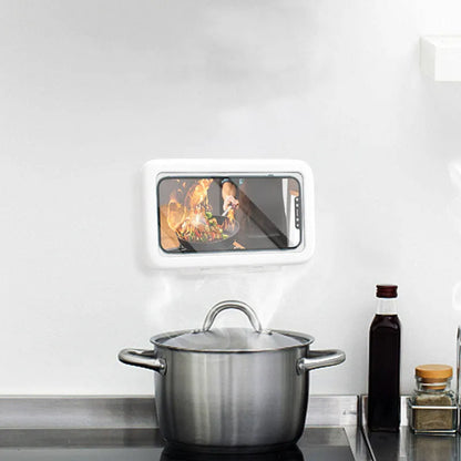 White waterproof phone case mounted on bathroom tile showing smartphone inside with touch screen accessible